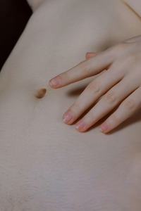 Polly Yangs Wearing Nothing But Her High Heels As She Reclines On The Leather Sofa