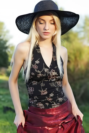 Skinny blonde Kira shows her small boobs and tight ass outdoor