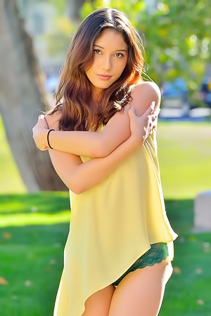 Melody Wylde takes off her yellow dress in the park