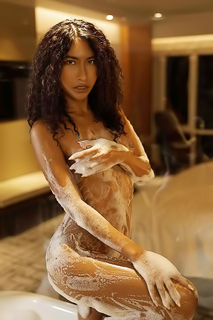 Nikki takes a bath in the jacuzzi presenting her natural curves and round booty