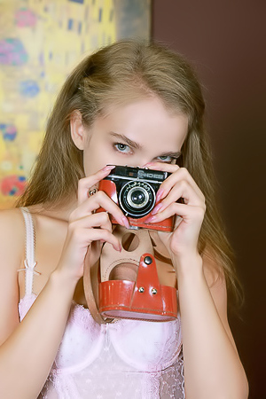 Xenia Glancing Back Over Her Shoulder With A Flirtatious Smile