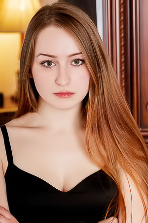 Evelin Her Soft Breasts Bare And Her Mesmerizing Blue Eyes Shining Seductively