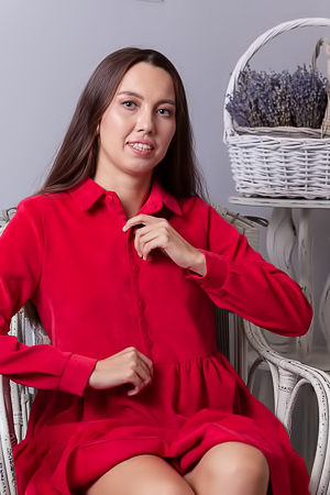 Zarusha Strips Out Of A Red Shirt Dress On A White Wicker Chair