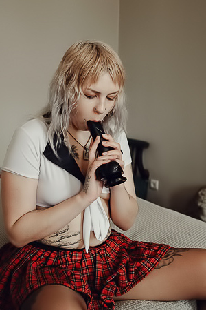 Sem Retlick Grabs Her Ass Enticingly In A Plaid Skirt And Black Pantyhose