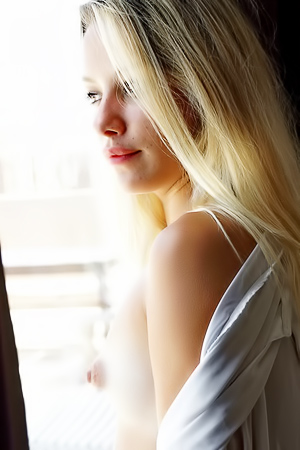 Candice Reveals Her Playful Striptease in Sunlight